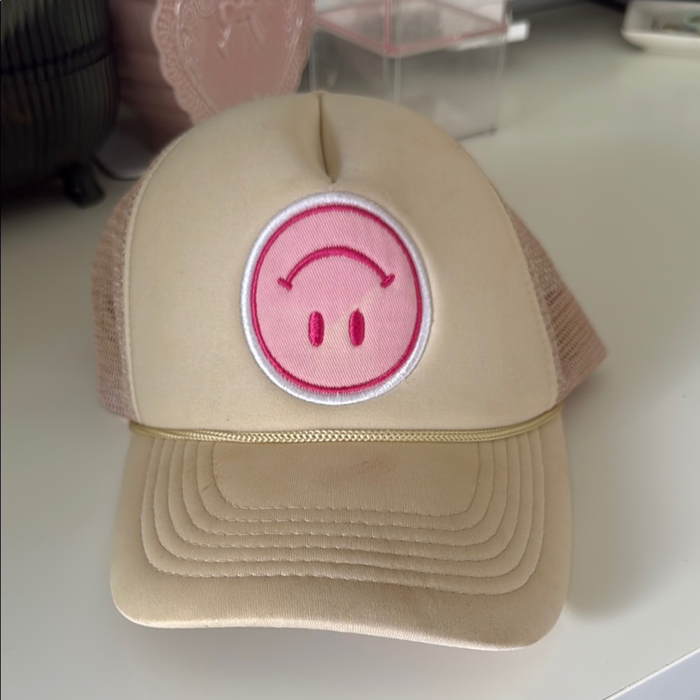 Packed Party Tan Trucker Hat with Pink Smiley Patch